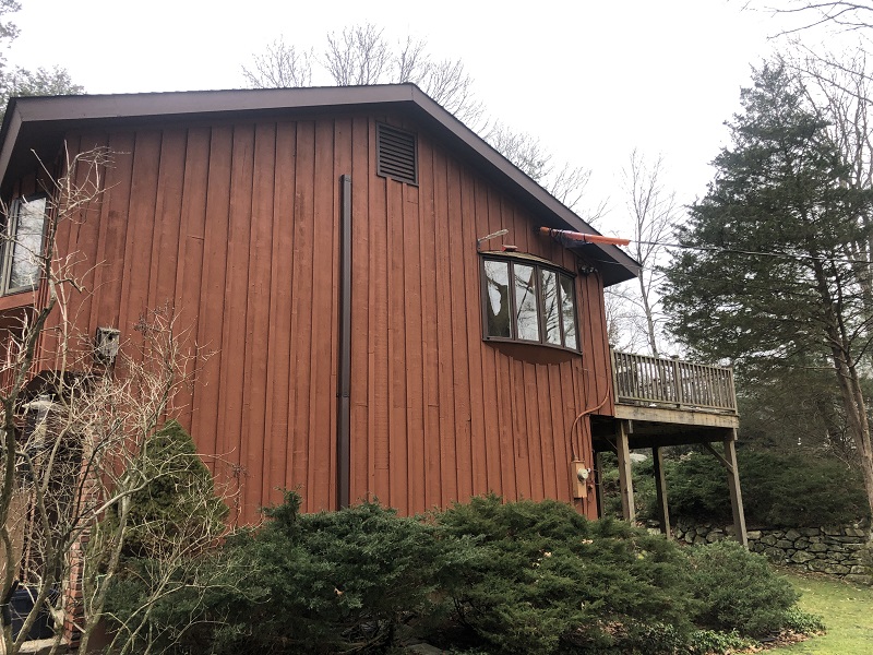 Brown bow window with a roof to be replaced by Window Solutions Plus